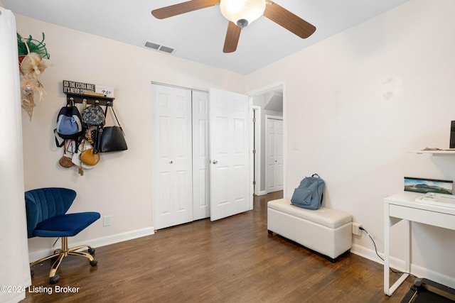 sitting room featuring ceiling fan and dark hardwood / wood-style flooring