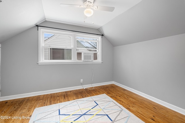 bonus room with hardwood / wood-style floors, cooling unit, ceiling fan, and lofted ceiling