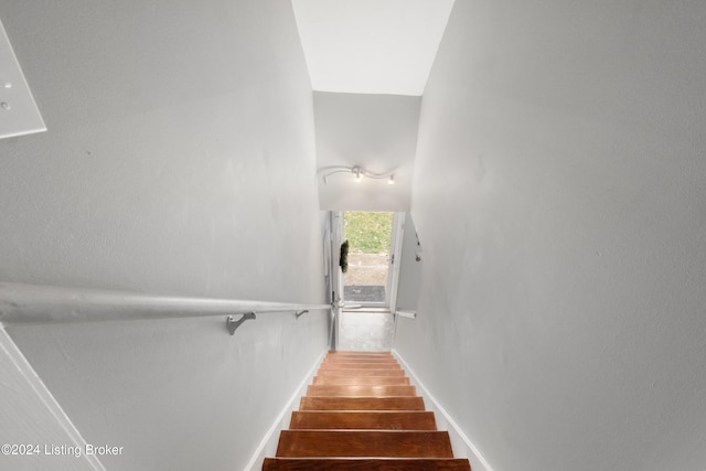 stairs with hardwood / wood-style floors