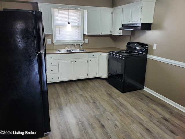 kitchen with black appliances, light wood-type flooring, white cabinetry, and sink