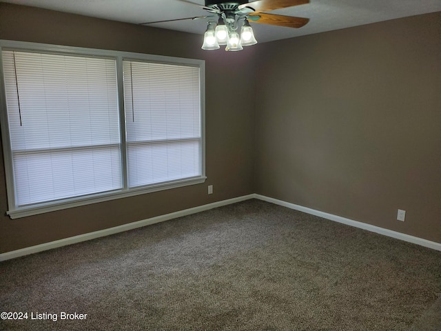 empty room featuring ceiling fan and carpet floors