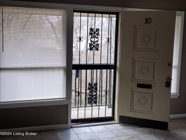 entrance foyer featuring light tile patterned floors