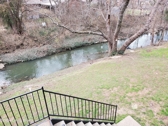 view of yard with a water view