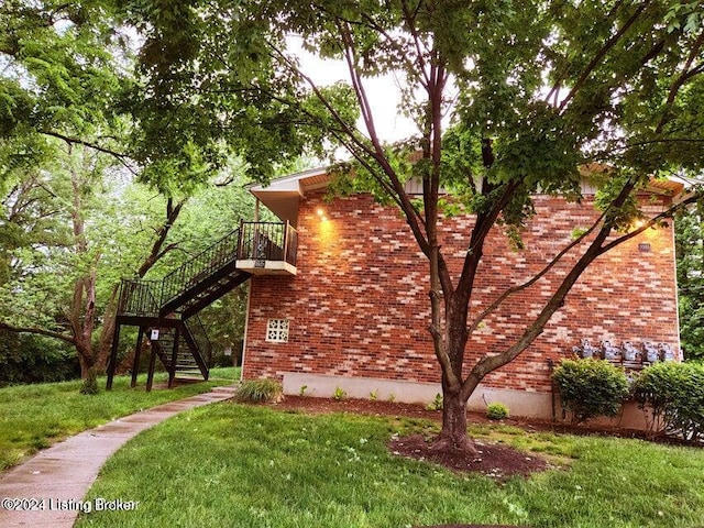 view of property exterior with a yard