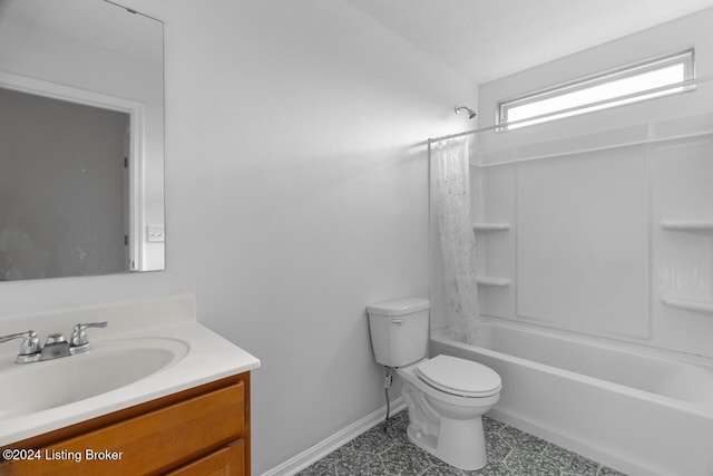 full bathroom featuring vanity, toilet, and shower / tub combo with curtain