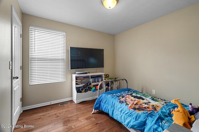 bedroom featuring wood-type flooring