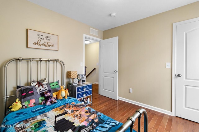 bedroom featuring wood-type flooring