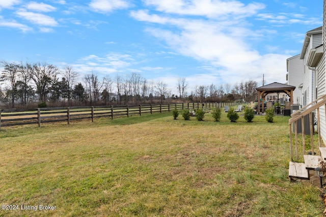 view of yard featuring a gazebo and a rural view