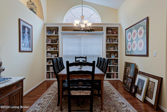 dining space featuring a textured ceiling, dark wood-type flooring, high vaulted ceiling, and a chandelier