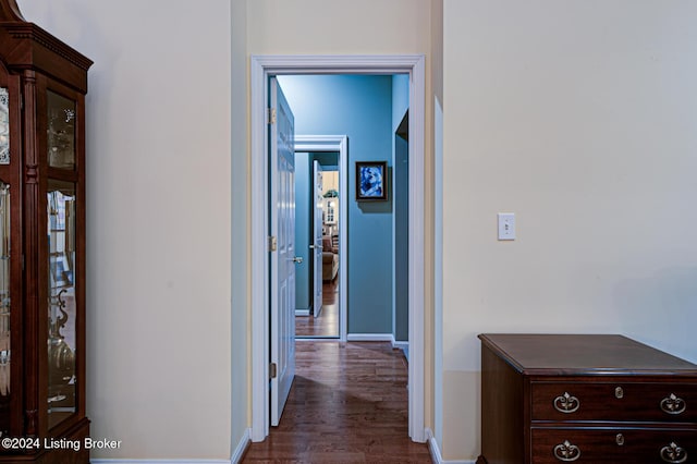 hall with dark hardwood / wood-style floors