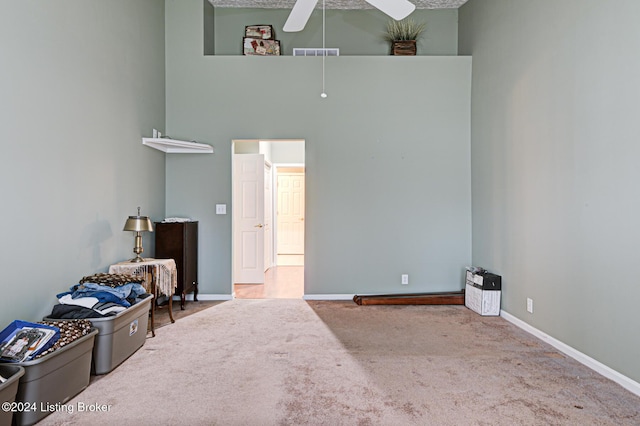 interior space featuring ceiling fan