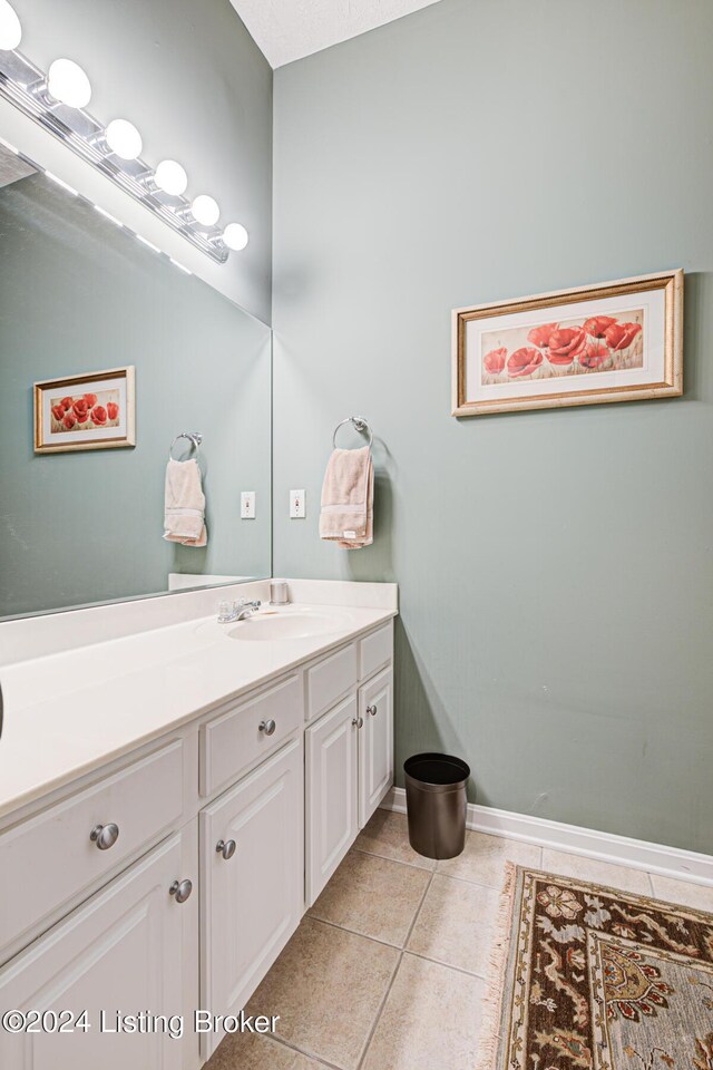 bathroom featuring tile patterned floors and vanity