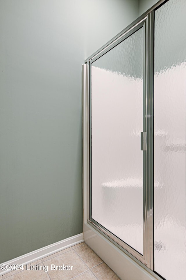 bathroom featuring tile patterned floors and walk in shower