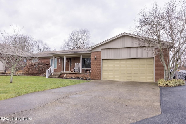 ranch-style house with a porch, a front lawn, and a garage