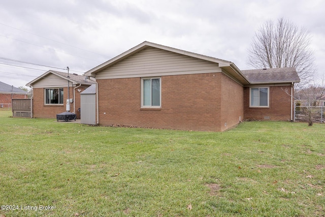 back of house with a yard