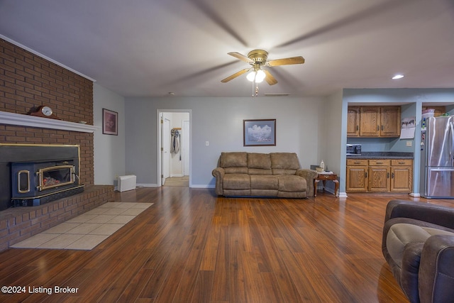 living room featuring ceiling fan and light wood-type flooring