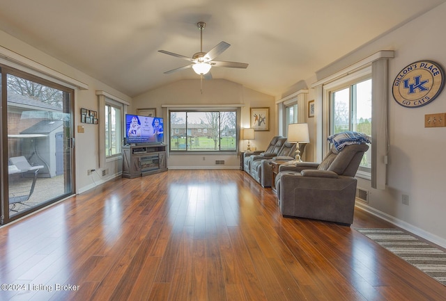 living room featuring vaulted ceiling, dark hardwood / wood-style floors, and ceiling fan