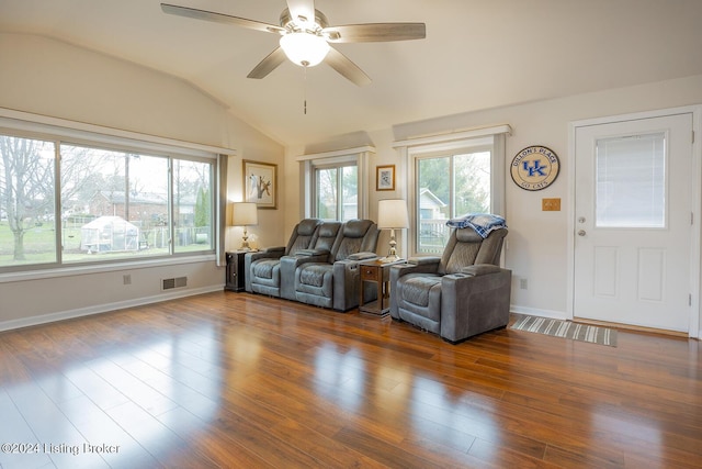 living room featuring ceiling fan, dark hardwood / wood-style flooring, and vaulted ceiling