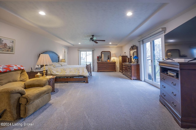 carpeted bedroom featuring ceiling fan and access to exterior