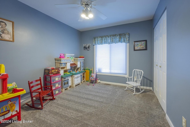 playroom featuring ceiling fan and carpet