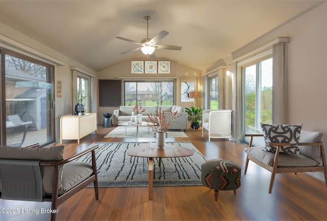 sunroom / solarium featuring ceiling fan and vaulted ceiling