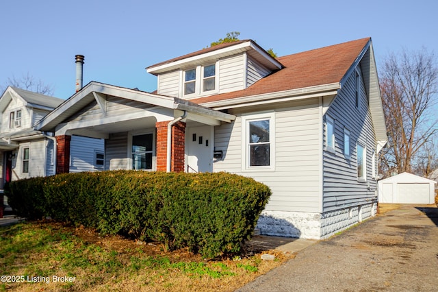 view of front of house featuring an outbuilding and a garage