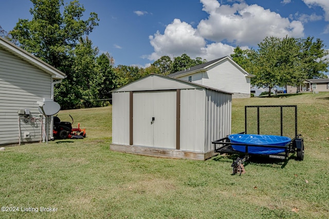 view of outbuilding featuring a lawn