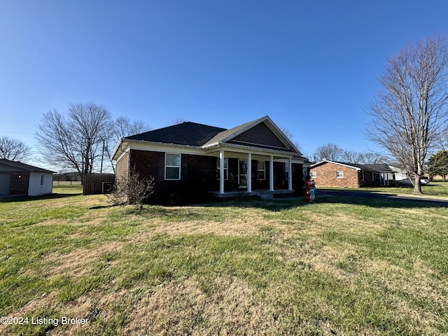 ranch-style home with a porch and a front yard