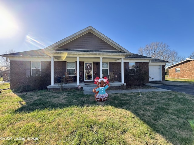 view of front of house with a garage, covered porch, and a front yard