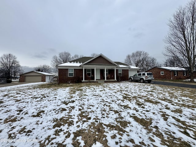 view of front of home with covered porch and a garage