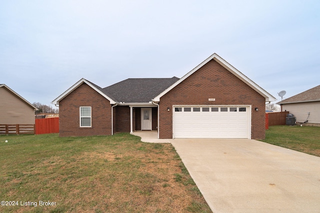 view of front of home with a garage and a front yard