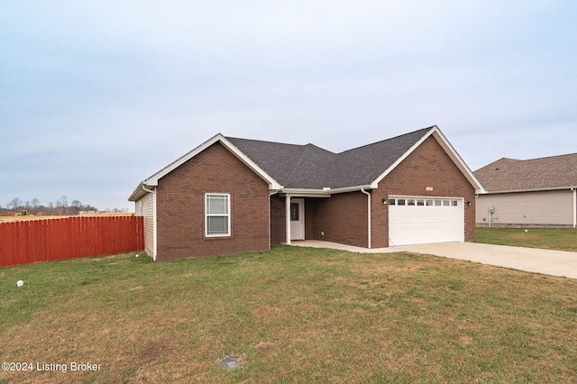 single story home featuring a front lawn and a garage