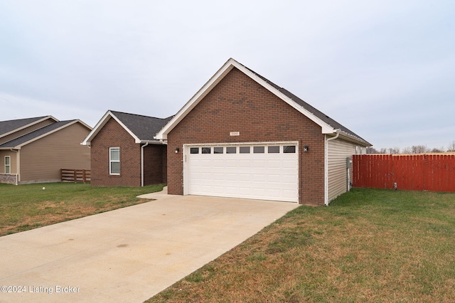 view of front of house featuring a front yard and a garage