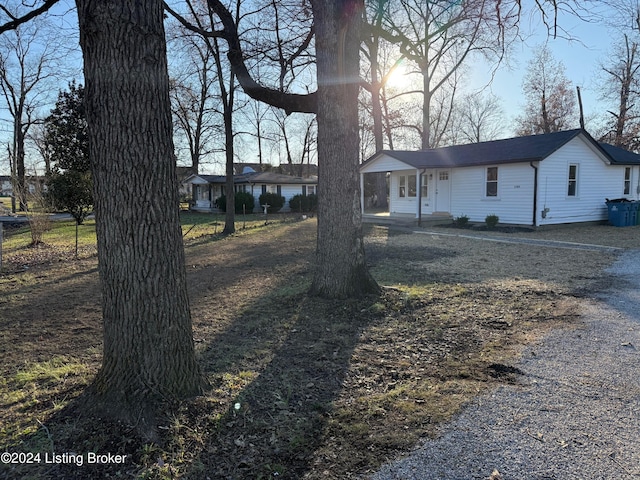 single story home featuring covered porch