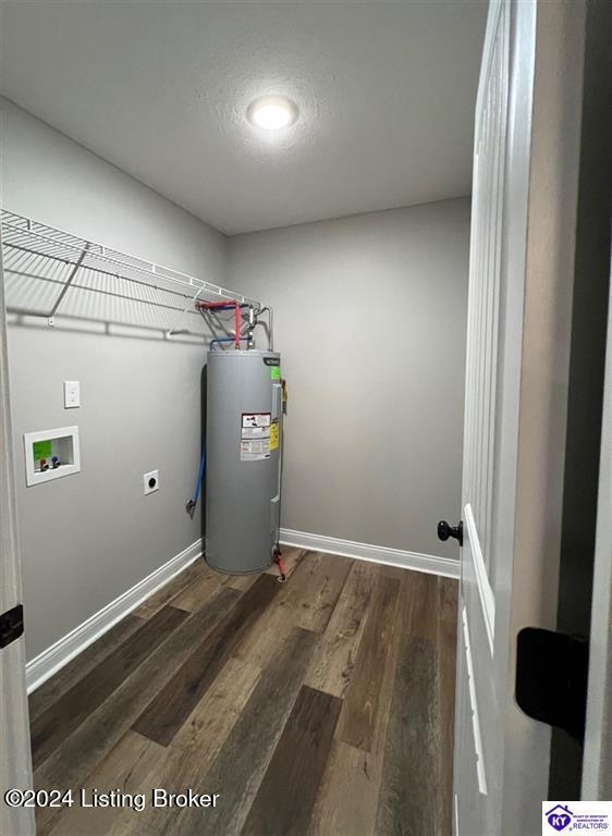 laundry room with washer hookup, electric dryer hookup, dark hardwood / wood-style flooring, and electric water heater