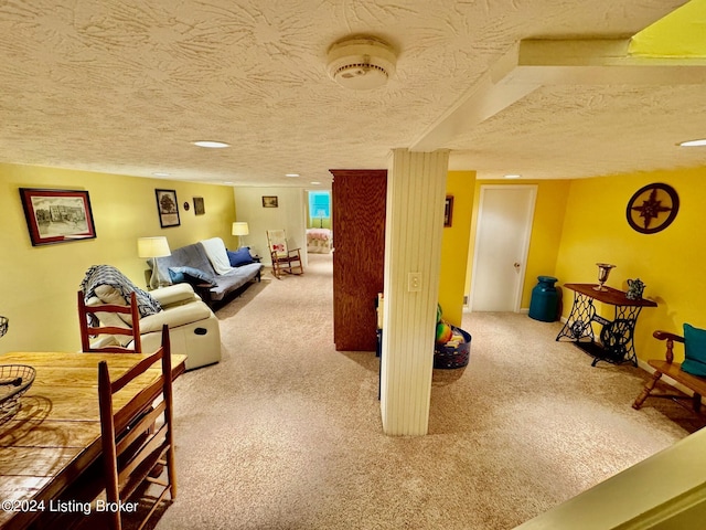 living room featuring carpet and a textured ceiling