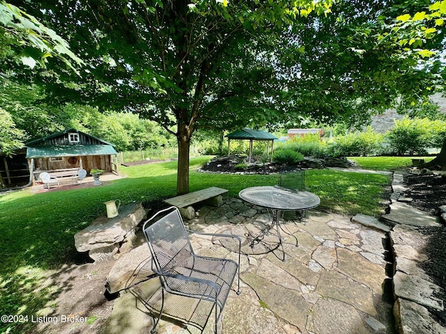 view of patio with an outdoor structure