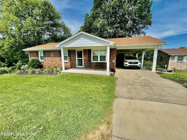 ranch-style home featuring a porch, a carport, and a front lawn