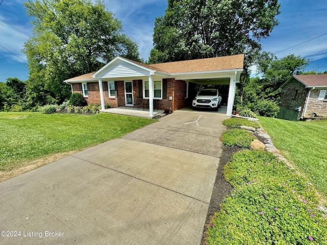 view of front facade with a carport, a porch, and a front lawn