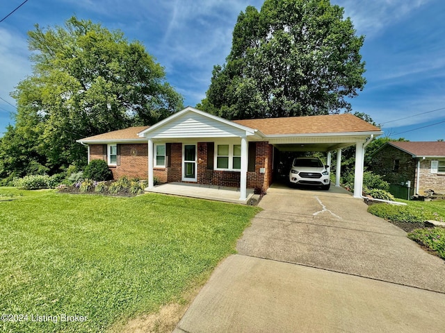 ranch-style house with covered porch, a carport, and a front lawn