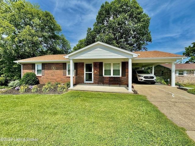 ranch-style house featuring a front yard, a porch, and a carport