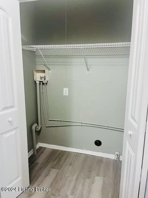 laundry room featuring hookup for a washing machine and hardwood / wood-style floors