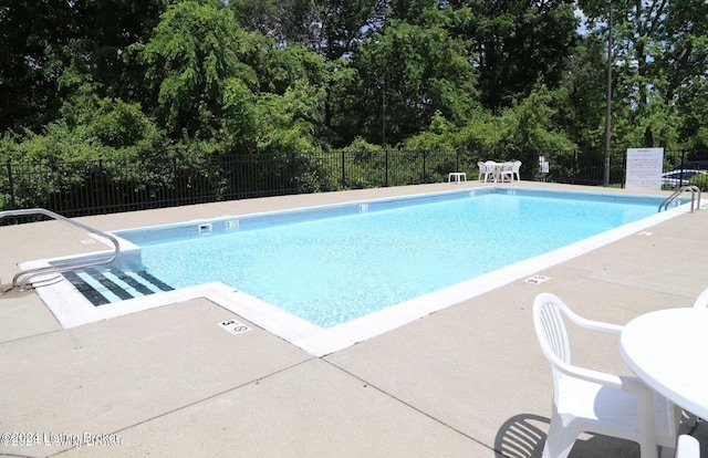 view of pool featuring a patio