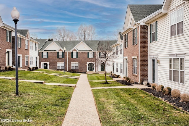 view of home's community with a lawn