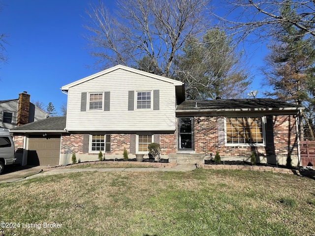 tri-level home with a garage and a front lawn