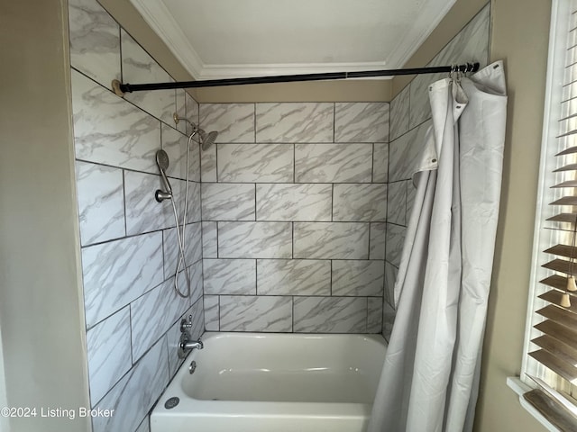 bathroom featuring shower / bath combo and crown molding