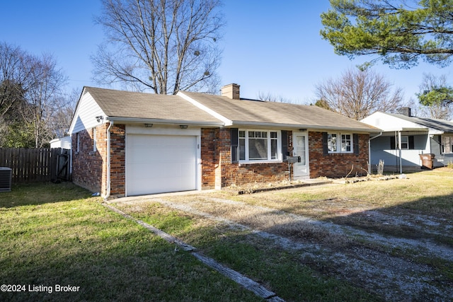 single story home with cooling unit, a front yard, and a garage