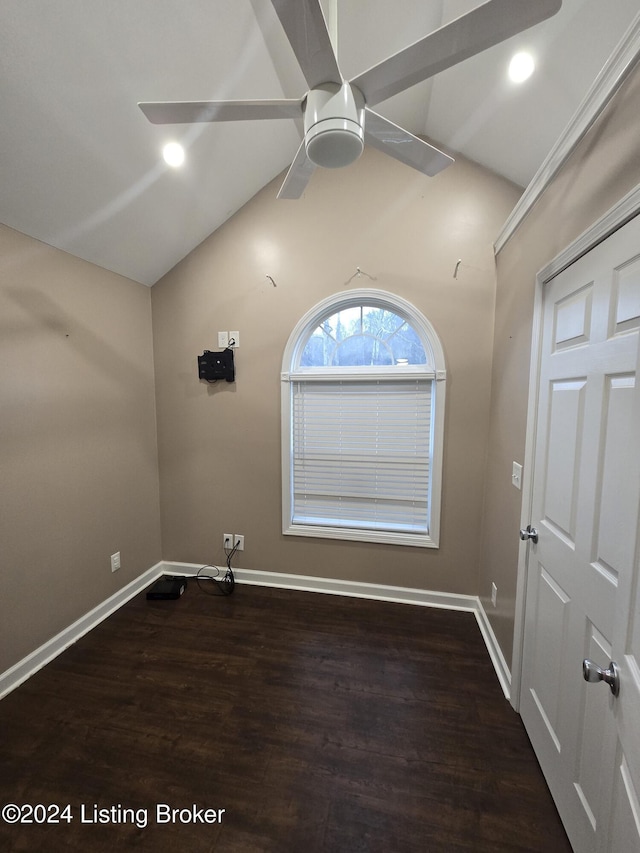 interior space with dark hardwood / wood-style floors, ceiling fan, and lofted ceiling