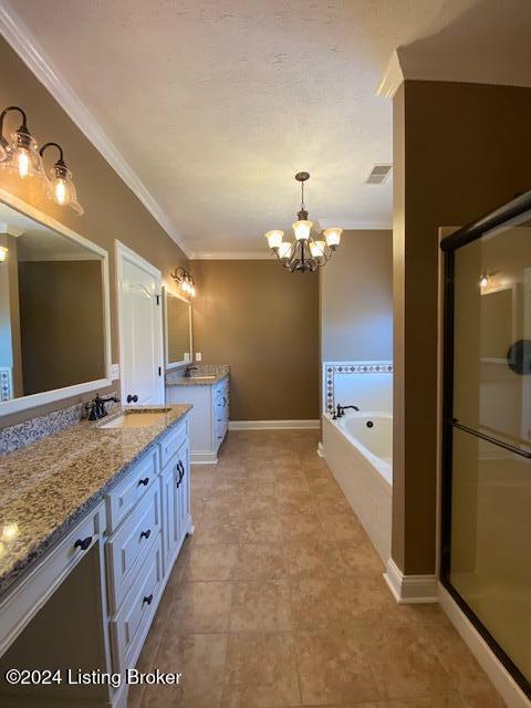 bathroom with vanity, ornamental molding, shower with separate bathtub, and an inviting chandelier