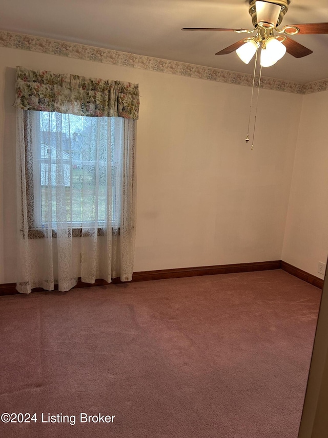 unfurnished room with carpet flooring and ceiling fan